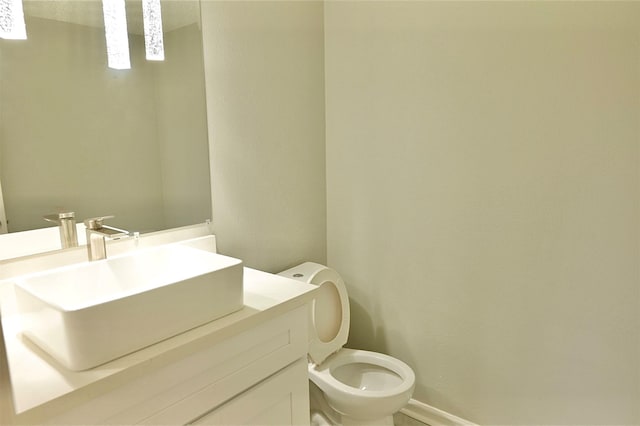 bathroom with toilet and vanity