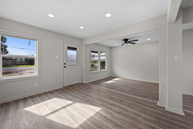 entryway with ceiling fan and dark hardwood / wood-style flooring