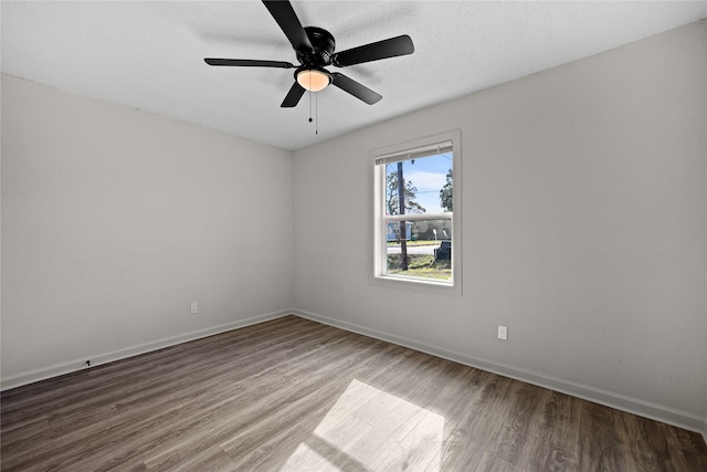 spare room featuring ceiling fan and wood-type flooring