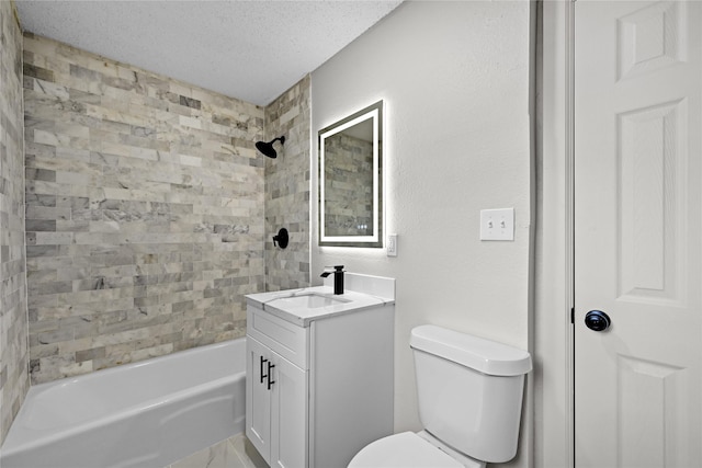 full bathroom with a textured ceiling, tiled shower / bath combo, vanity, and toilet