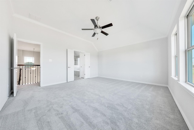 unfurnished bedroom with ceiling fan, connected bathroom, crown molding, and carpet flooring