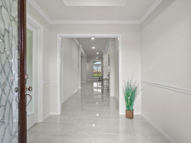 hallway featuring ornamental molding