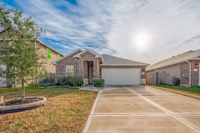 view of front of property featuring a front yard and a garage