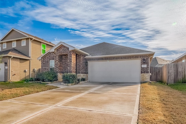 view of front of house with a garage and a front yard