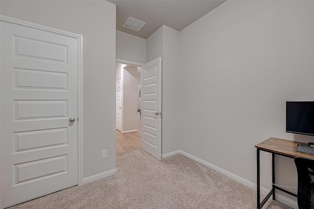 unfurnished bedroom featuring light colored carpet