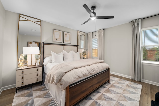 bedroom with light wood-type flooring and ceiling fan