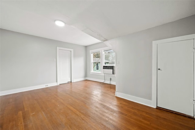 spare room with hardwood / wood-style floors