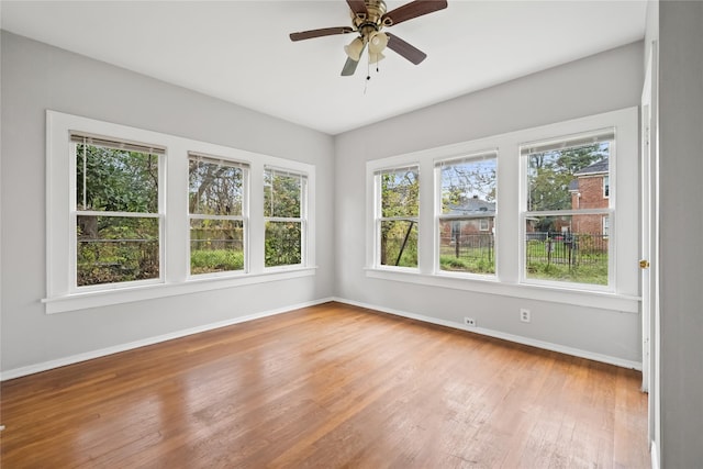 unfurnished room featuring ceiling fan and wood-type flooring