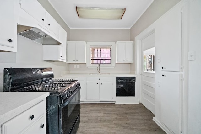 kitchen featuring light hardwood / wood-style floors, sink, white cabinetry, and black appliances