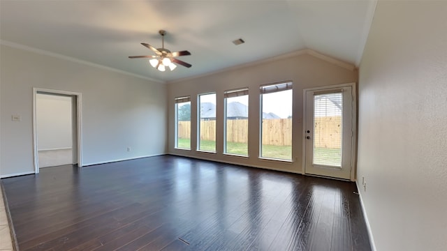 spare room featuring dark wood-type flooring, a mountain view, vaulted ceiling, ceiling fan, and crown molding