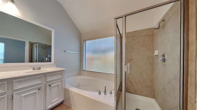 bathroom with lofted ceiling, vanity, and shower with separate bathtub