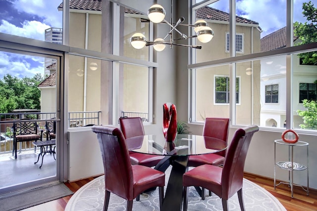 dining space featuring a chandelier and hardwood / wood-style flooring