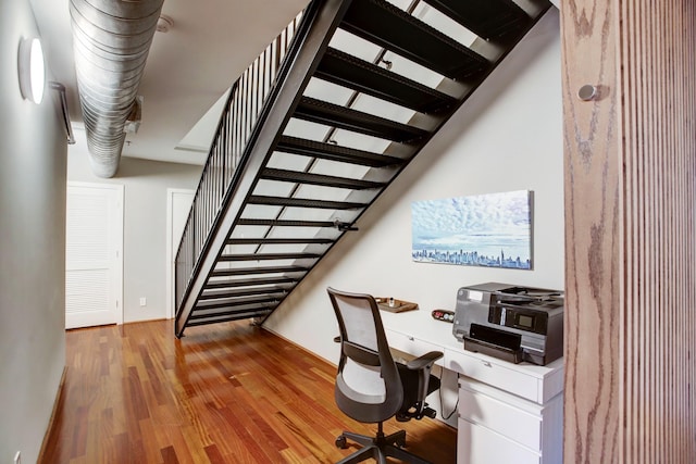 office space with hardwood / wood-style flooring and built in desk