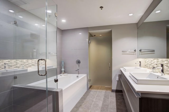 bathroom with vanity, tile patterned flooring, and shower with separate bathtub