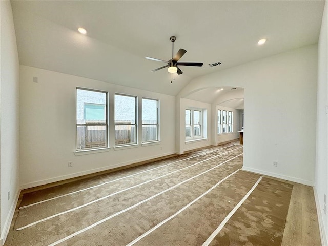 unfurnished room featuring ceiling fan and lofted ceiling