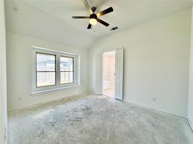 unfurnished bedroom featuring ceiling fan, vaulted ceiling, and connected bathroom