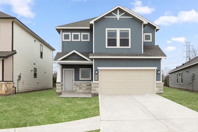 view of front facade featuring a front lawn and a garage