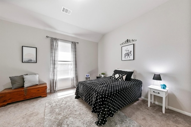 bedroom with lofted ceiling and carpet floors