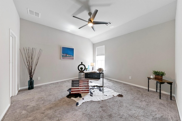 carpeted office space featuring ceiling fan and lofted ceiling