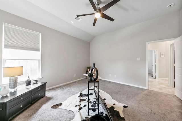 exercise area with ceiling fan, light carpet, and lofted ceiling