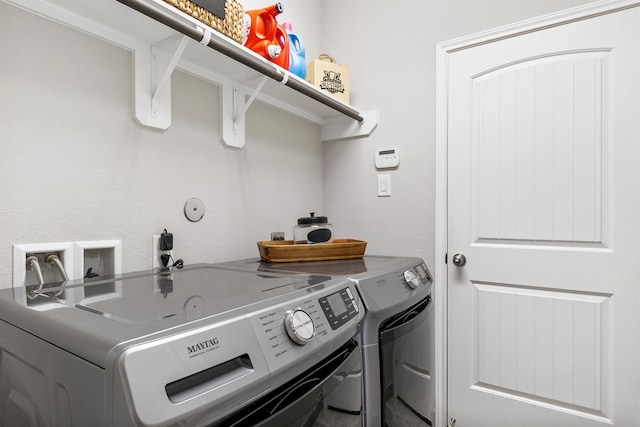 laundry room with washing machine and dryer