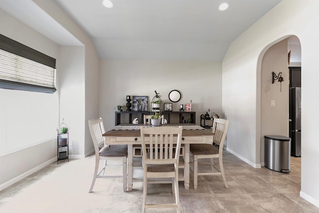 dining area with lofted ceiling