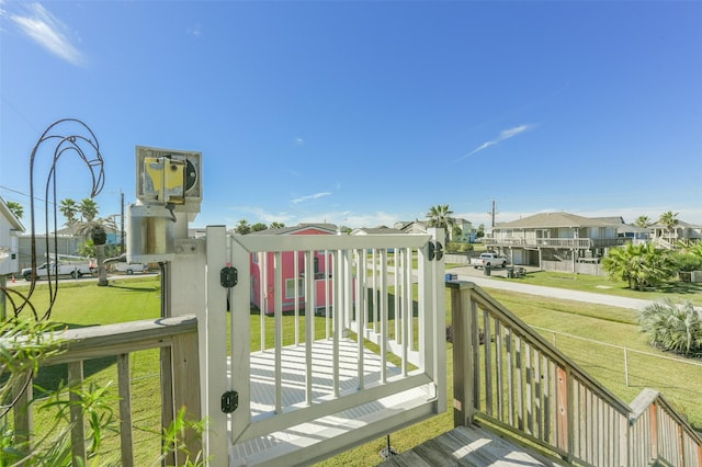 view of gate featuring a yard