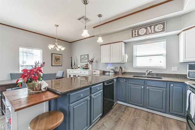 kitchen with kitchen peninsula, blue cabinets, dishwasher, white cabinets, and sink