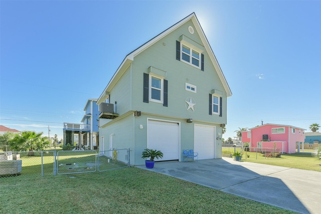 rear view of property featuring a yard and a garage