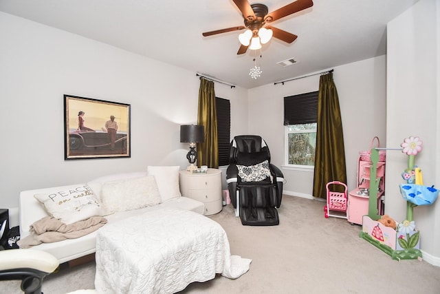 bedroom with ceiling fan and carpet floors