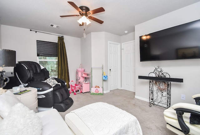 bedroom with ceiling fan and light carpet