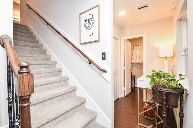 staircase featuring hardwood / wood-style flooring