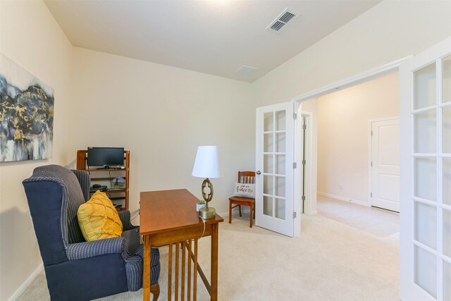 office featuring light colored carpet and french doors