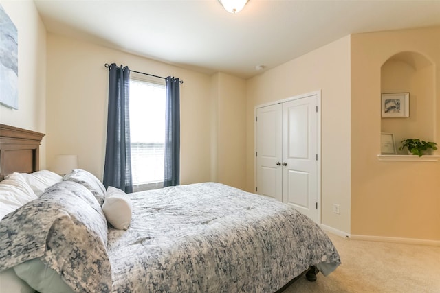 carpeted bedroom featuring a closet