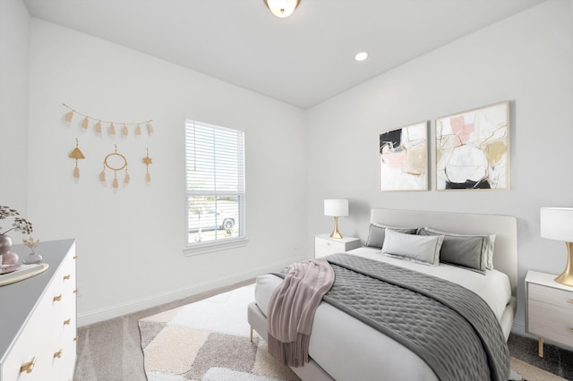 bedroom featuring light colored carpet