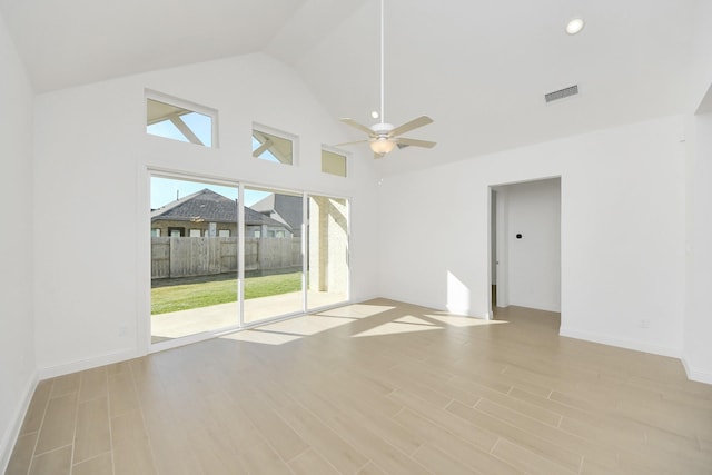 unfurnished room featuring ceiling fan and high vaulted ceiling