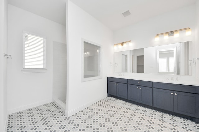 bathroom with walk in shower and vanity