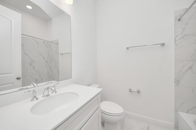 bathroom featuring toilet and vanity