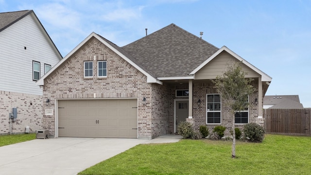 view of front facade with a garage and a front lawn