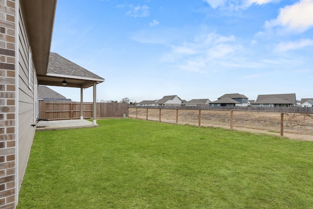 view of yard featuring ceiling fan