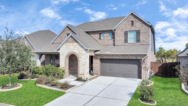 view of front of property featuring fence, a front lawn, concrete driveway, and brick siding