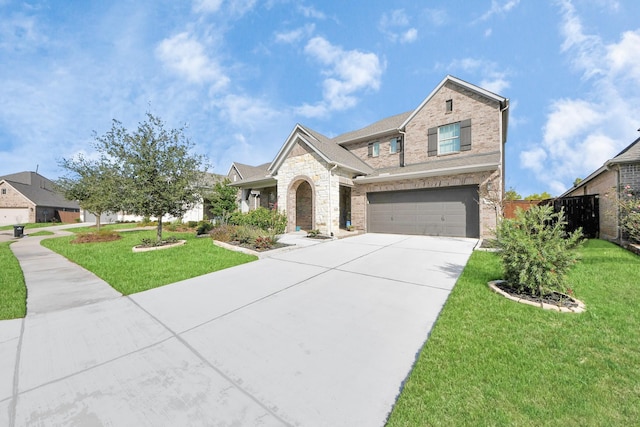 view of front of home with brick siding, concrete driveway, an attached garage, stone siding, and a front lawn