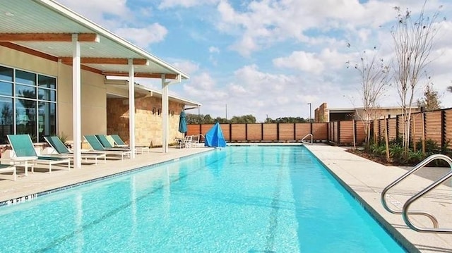 view of pool featuring a patio area