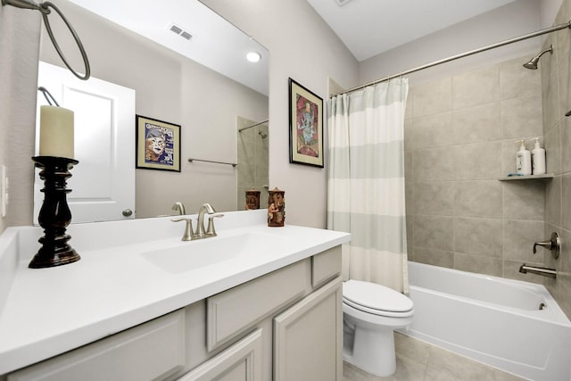 full bath featuring visible vents, toilet, shower / bath combo, vanity, and tile patterned floors