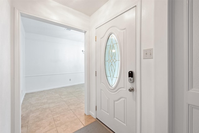 view of tiled foyer entrance