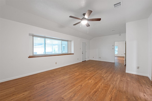 unfurnished room featuring vaulted ceiling, ceiling fan, and light hardwood / wood-style flooring