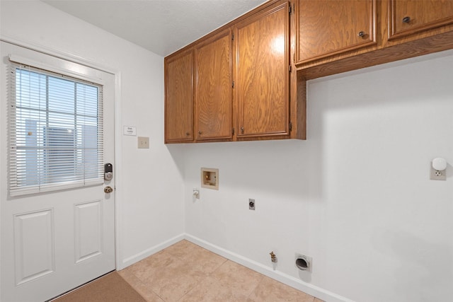 laundry area with cabinets, hookup for a washing machine, gas dryer hookup, and hookup for an electric dryer