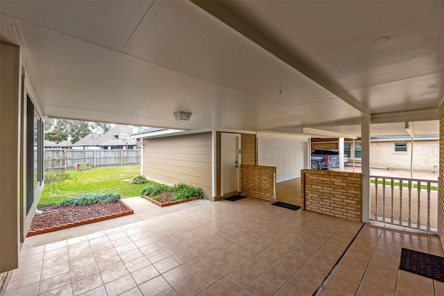 view of patio / terrace featuring a garage