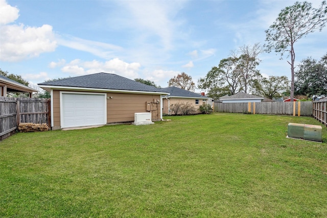 view of yard featuring a garage