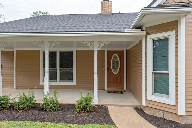 property entrance featuring covered porch